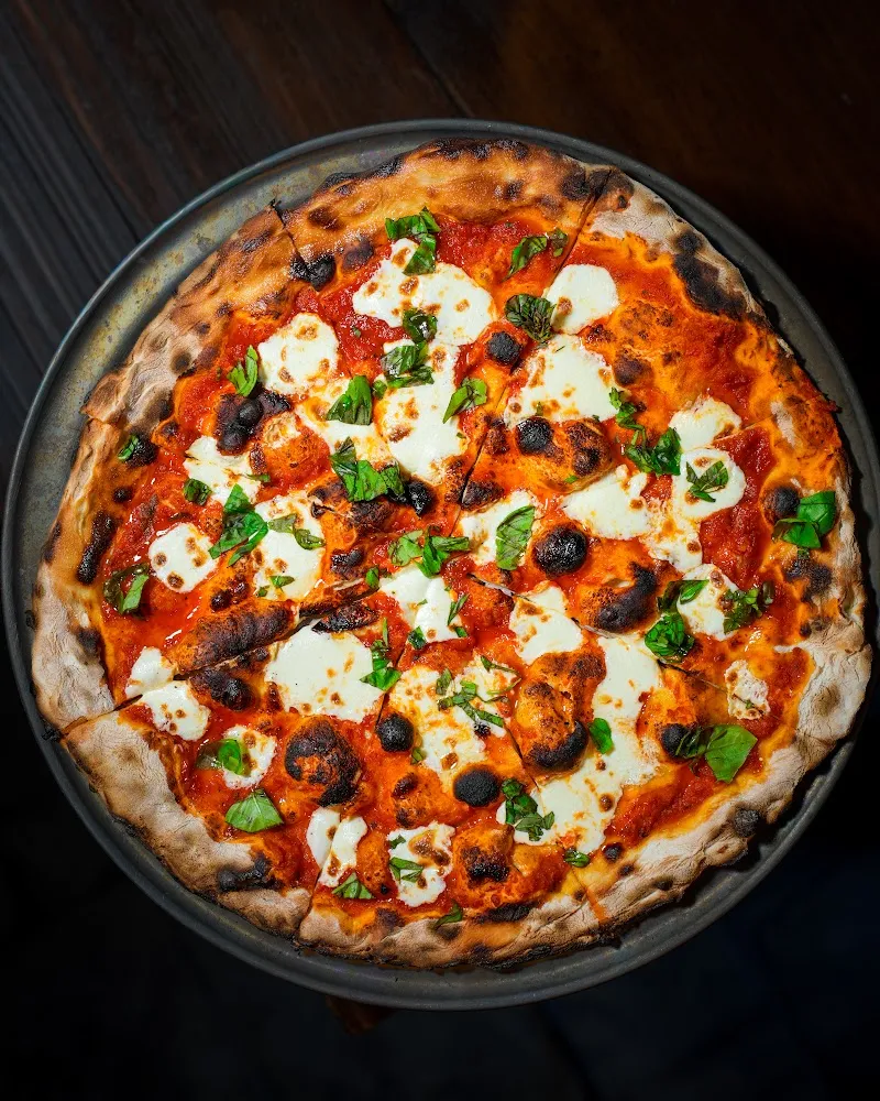 Wood-fired margherita pizza overhead, restaurant photography Hudson Valley