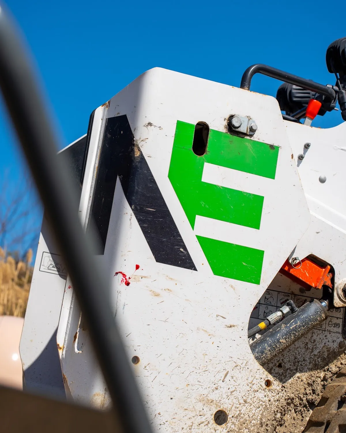 Landscaping skid steer equipment close-up, construction photography Hudson Valley
