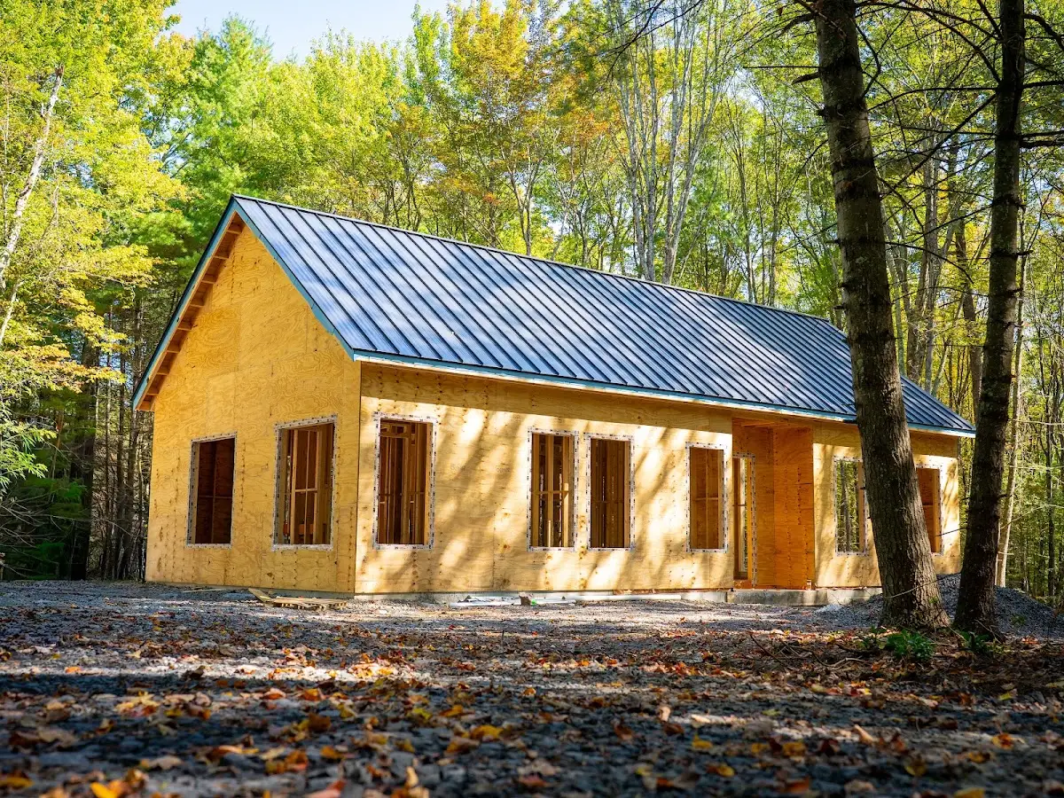 New home construction framing with metal roof, construction photography Hudson Valley