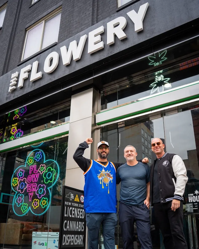 Licensed cannabis dispensary storefront with team, dispensary photography New York