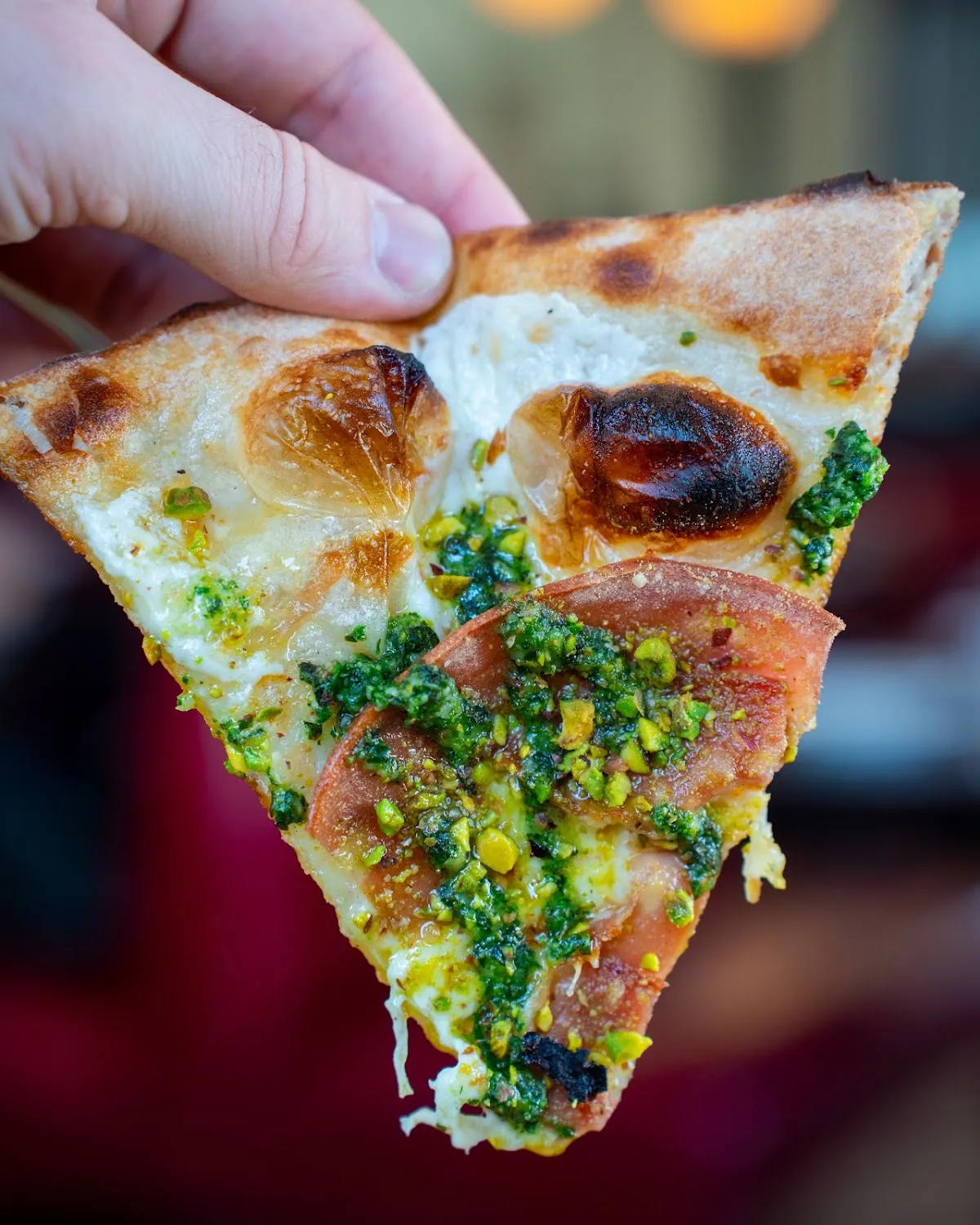 Pistachio pepperoni pizza slice, food photography Hudson Valley