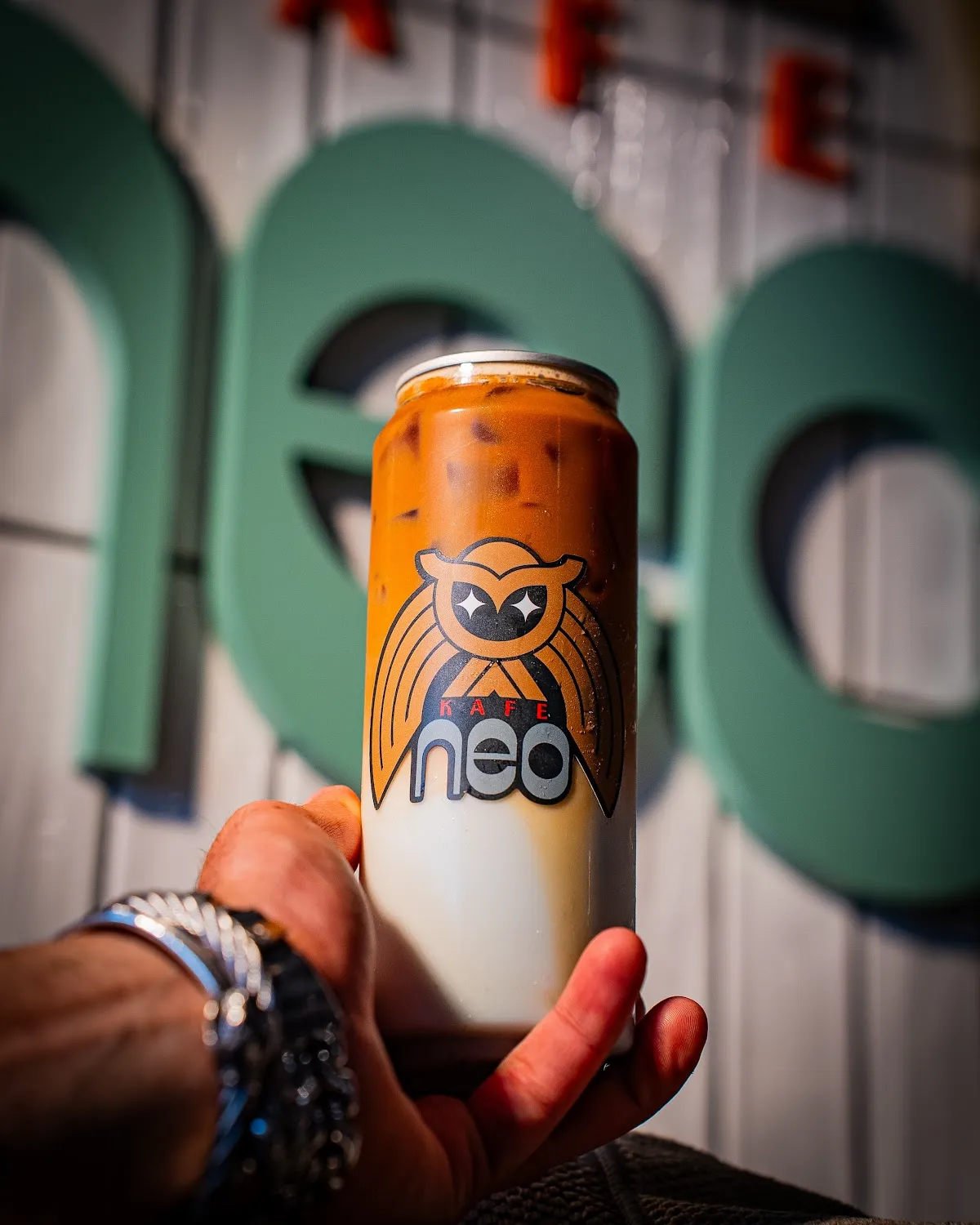 Hand holding iced coffee can, cafe brand photography Hudson Valley