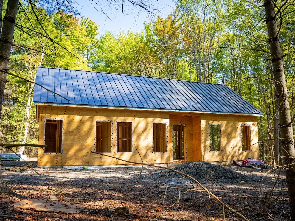 New build framing exterior in the woods, construction photography Hudson Valley