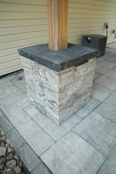 Finished stone pillar and paver patio by Natures Edge, photography by Evolved Media
