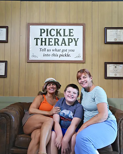 Family photo at the Eastdale Village Pickle Festival photo booth