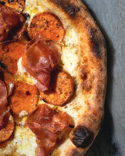 Wood-fired soppressata pizza at Pizzeria Posto Eastdale, food photography